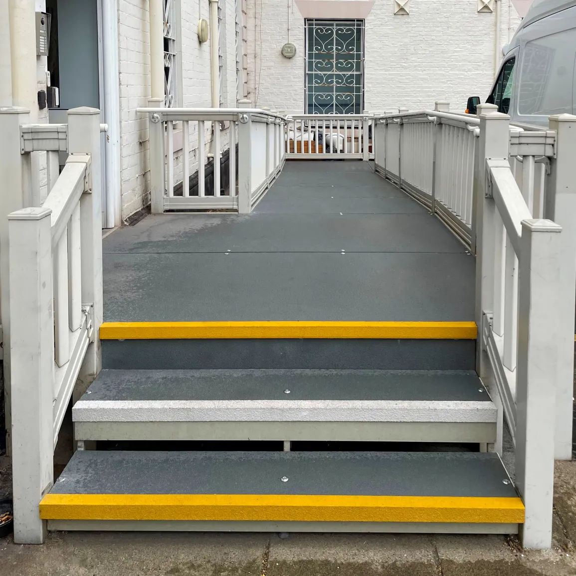 Hartlepower Community Interest Company runs a micro business centre in Greenbank, Stranton, Hartlepool. We offer facilities to community organisations, charities, small businesses and house the Hartlepower Community Trust voluntary development team who offer support to all community organisations within the town. Our existing ramp access to the building was beyond economic repair and was essential for those with limited mobility who use our building on a regular basis.
We required an economical solution, a complete replacement was beyond our funding capabilities. Luckily, a chance encounter in the North Sea between sea swimming buddies, one a Director of Hartlepower and the other, a Manager of BM Steel led us to using GRP as an ideal solution.